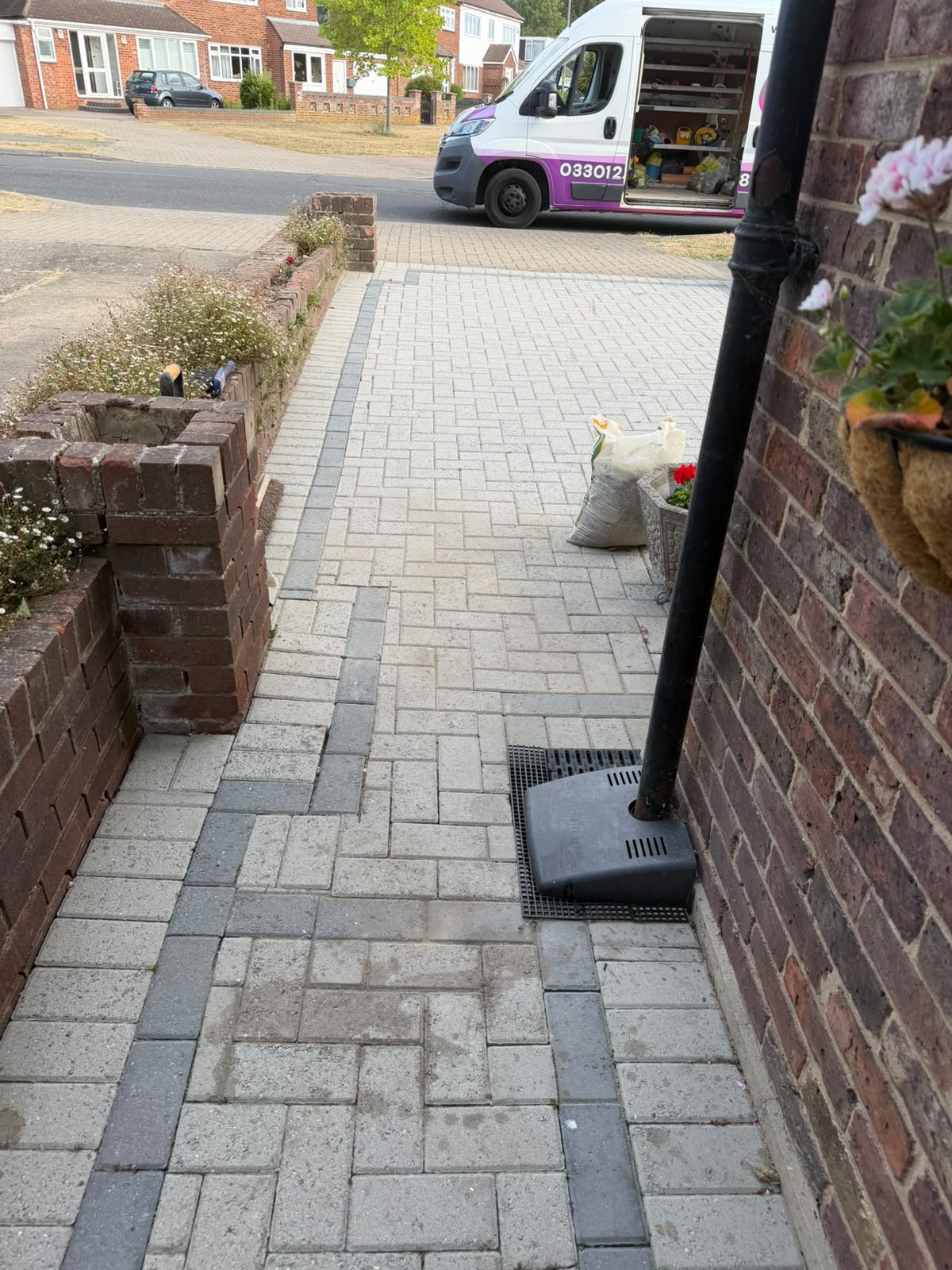 Finished driveway with new channel drain and downpipe connection