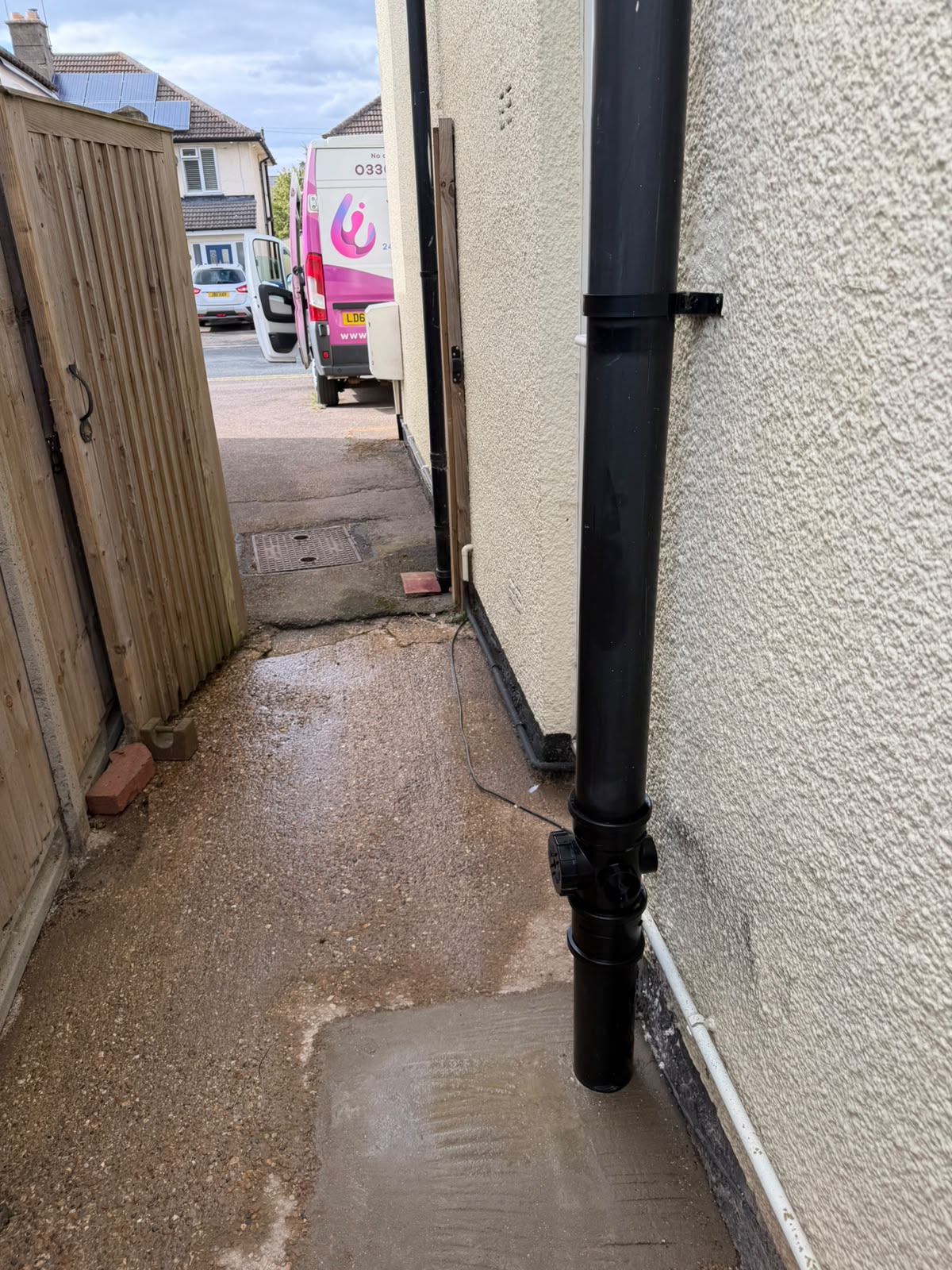 New black soil stack with rodding access fitted and the path re-concreted